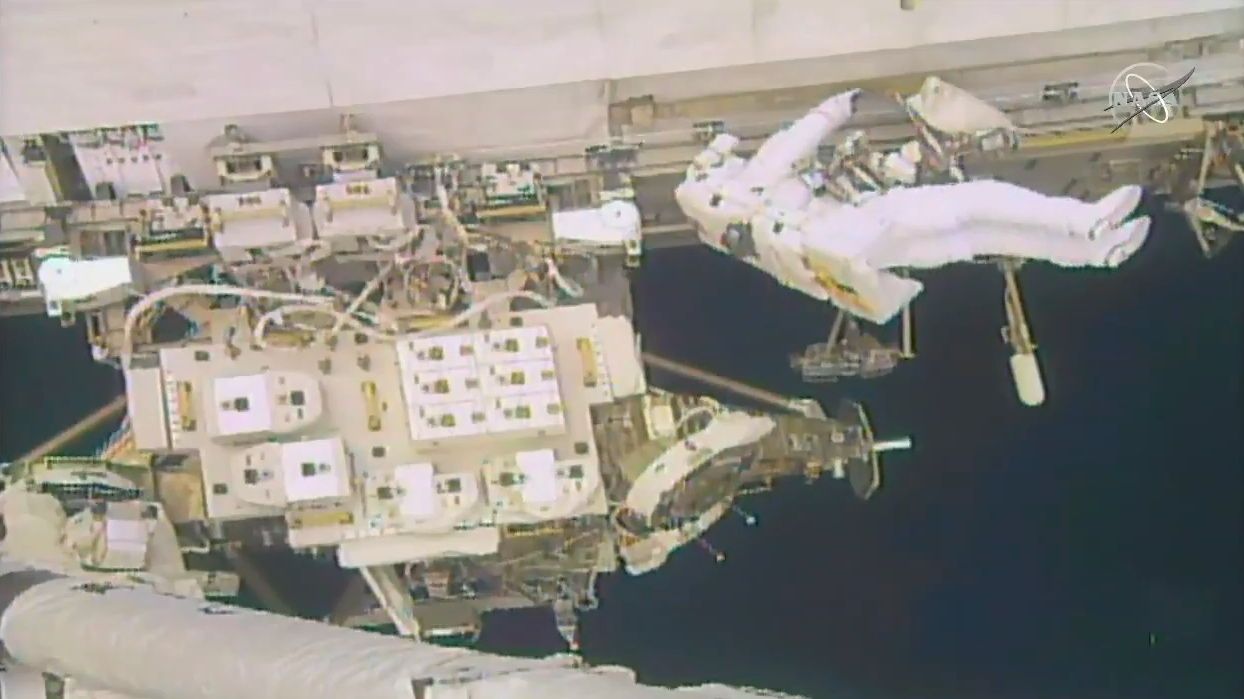 NASA astronaut Nick Hague works on his "get-ahead" task at the end of today's spacewalk.