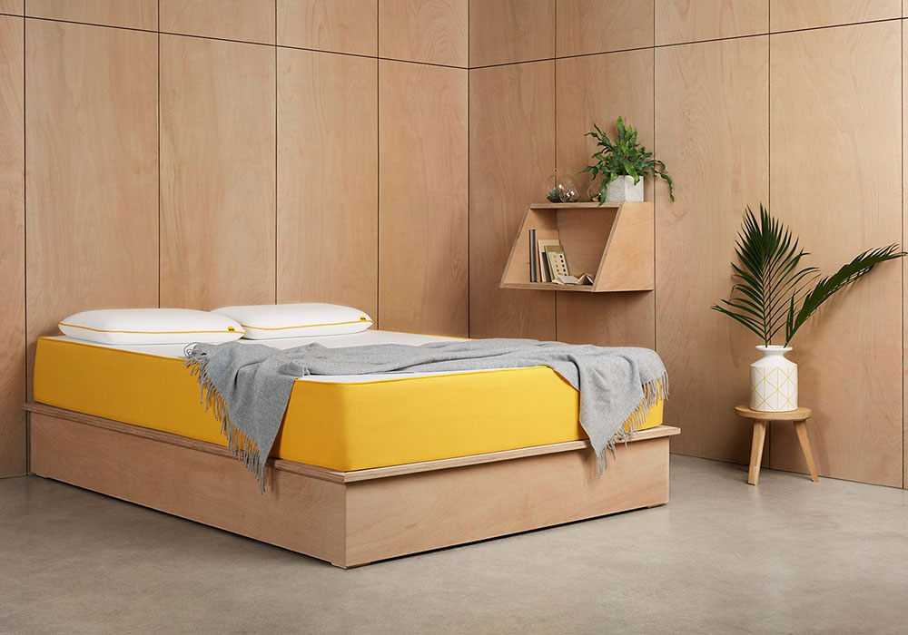 bedroom with wooden wall and bed