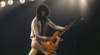 Jimmy Page performs with Led Zeppelin