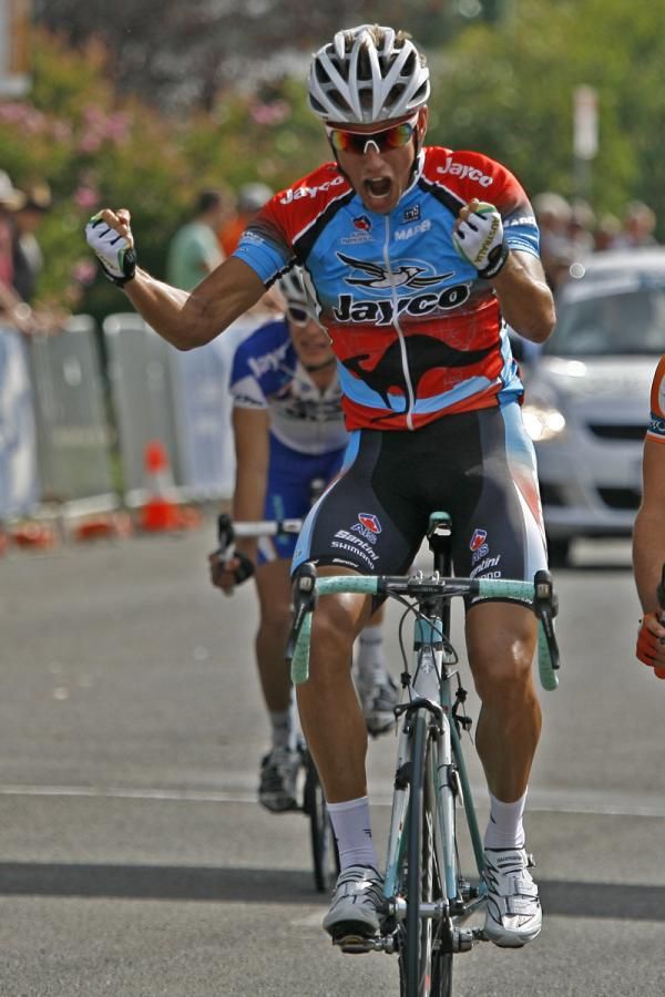 Lang shows his excitement at his win as he crosses the finish line