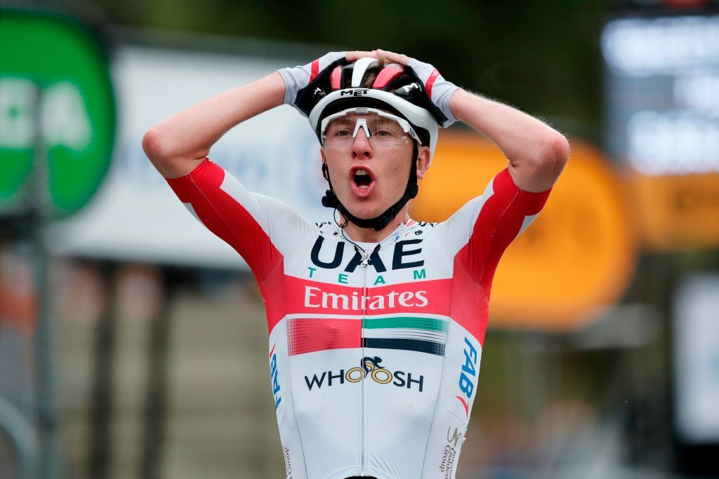 Stage winner Team UAE Emirates rider Slovenias Tadej Pogacar celebrates as he crosses the finish line at the end of the 9th stage of the 107th edition of the Tour de France cycling race 154 km between Pau and Laruns on September 6 2020 Photo by BENOIT TESSIER POOL AFP Photo by BENOIT TESSIERPOOLAFP via Getty Images