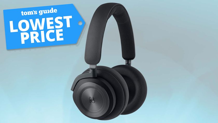 A pair of B&amp;O headphones on a background with the Tom&#039;s Guide &quot;lowest price&quot; deal badge added