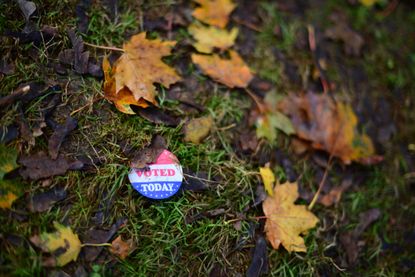 A voting sticker on the ground