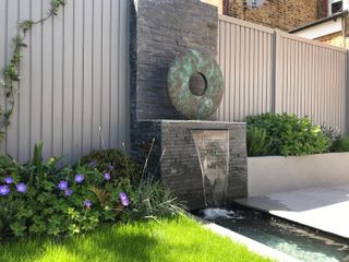 how to design a child friendly garden: Tom Howard water feature
