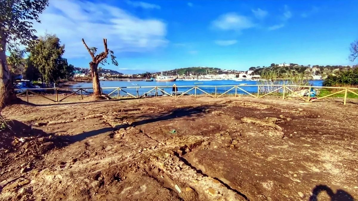 Archaeological site of an excavated roman villa by the water.