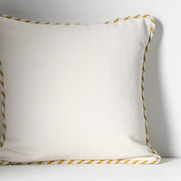 Kayla Piped Cushion in white: was £68 now £54 | Anthropologie (Save £14)