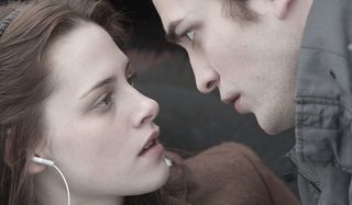 Robert Pattinson and Kristen Stewart as Edward Cullen and Bella Swan in Twilight