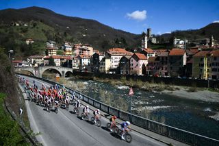 The pack of riders cycles along Campo Ligure during the 115th Milan-SanRemo one-day classic cycling race, between Pavia and SanRemo, on March 16, 2024. (Photo by Marco BERTORELLO / AFP)