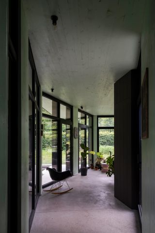 Spacious interiors at house BPB by David Bulckaen look out towards nature