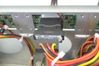 One drawback to using a non-proprietary power supply is the number of available connections. Molex adapters hot-glued to SATA power leads just don't seem right.