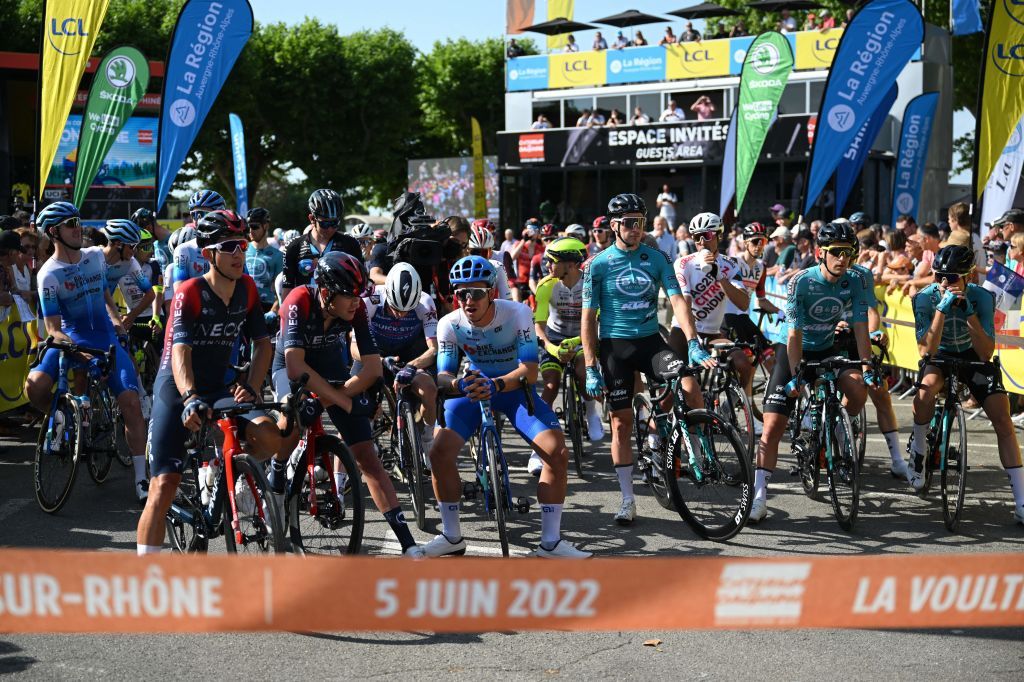 Riders wait for the start of the first stage of the 74th edition of the Criterium du Dauphine cycling race 192 km between La VoultesurRhone and Beauchastel on June 5 2022 Photo by Marco BERTORELLO AFP Photo by MARCO BERTORELLOAFP via Getty Images