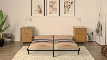 Emma Platform Bed in bedroom without mattress, with artwork above the bed and two bedside tables