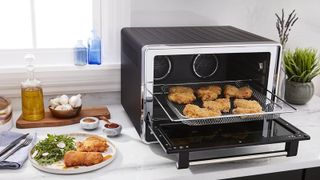 The KitchenAid toaster oven air frying nuggets on a tray