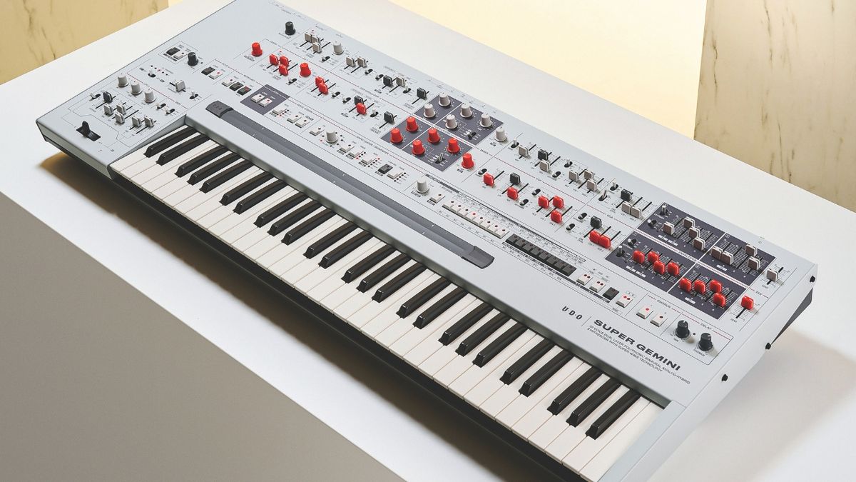 An UDO Super Gemini synthesizer on a white table