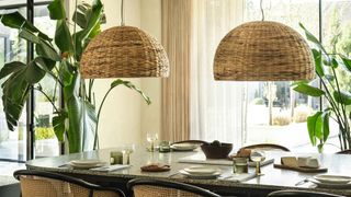 dining table with two oversized wicker pendant lights