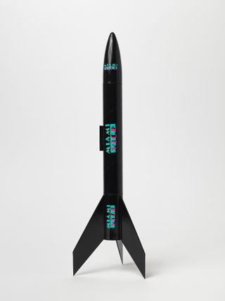 Model rocket, black Miami Vice motifs, white background