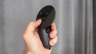 Holding a Quest Touch Pro controller