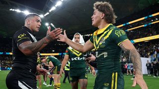 Erin Clark of New Zealand and Reece Walsh of Australia embrace after the opening game of the Rugby League World Cup 2026