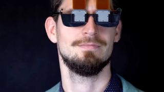 A man with a beard wears VR glasses