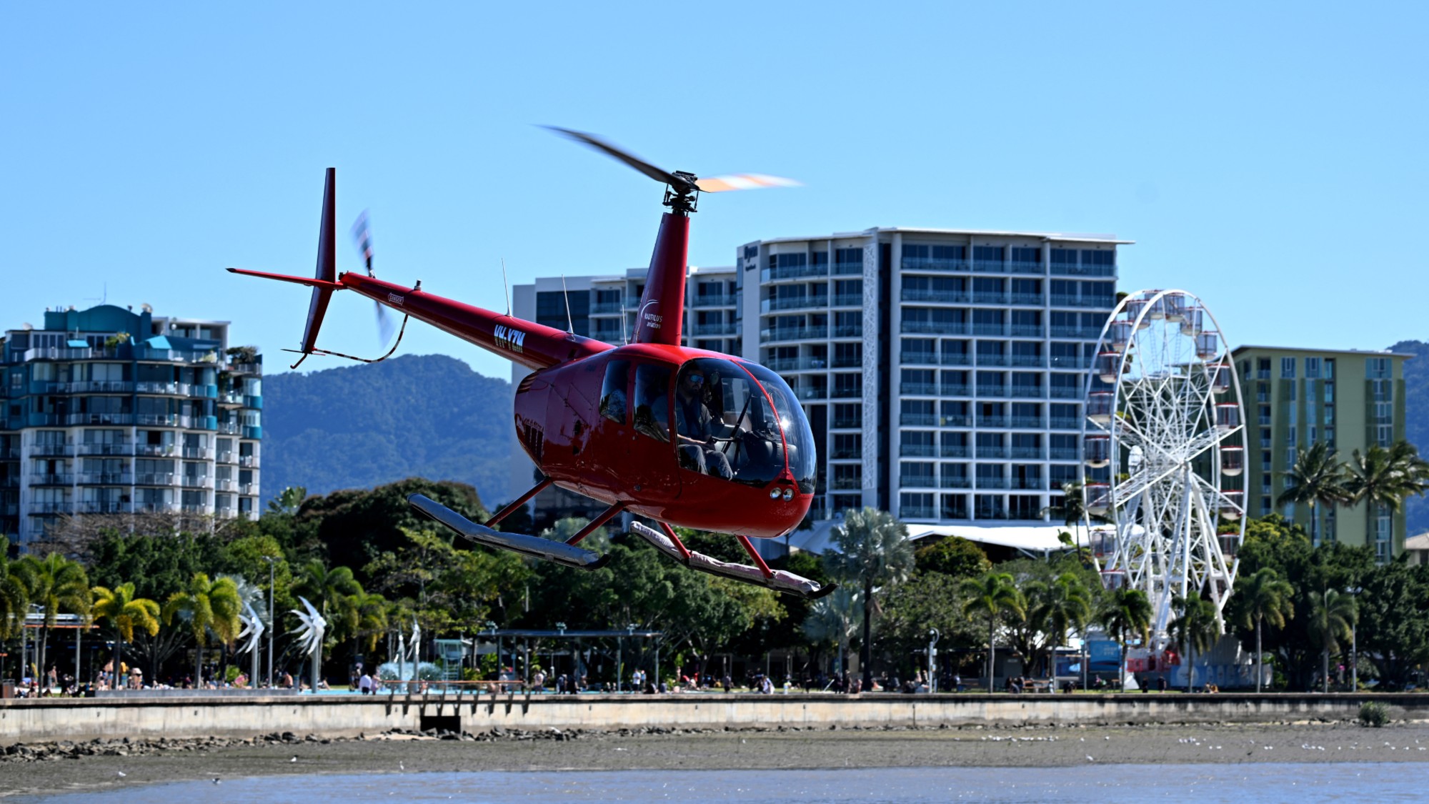 A helicopter takes off on a sightseeing trip in Cairns, Australia. 