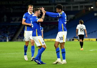 Brighton and Hove Albion’s Bernardo (right) celebrates scoring his side’s third goal of the game with his teammates during the Carabao Cup second round match at the AMEX Stadium, Brighton