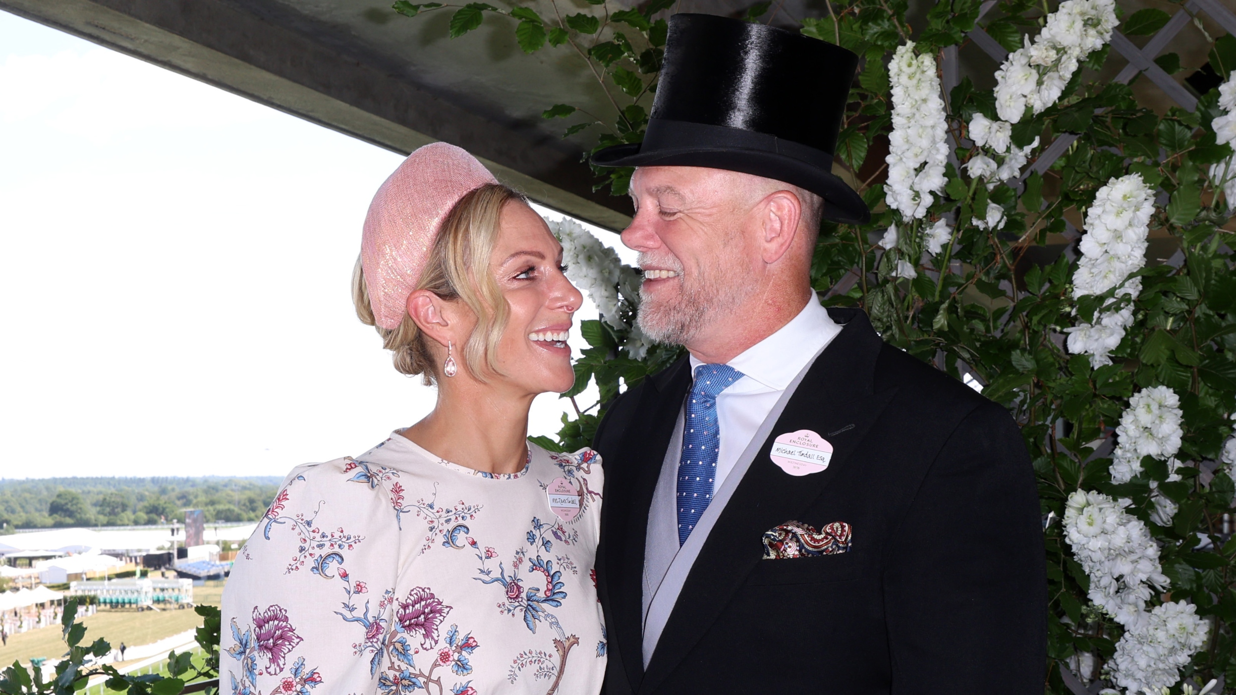 Zara Tindall and Mike Tindall smile and look at each other as they attend Royal Ascot on June 18, 2025