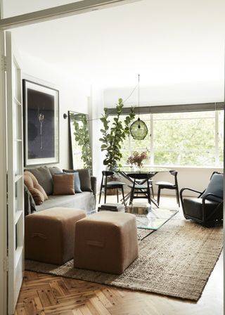 A living room with an underfoot jute rug