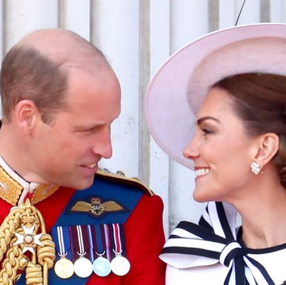 Prince William and Kate Middleton smiling at each other at Trooping the Colour 2024