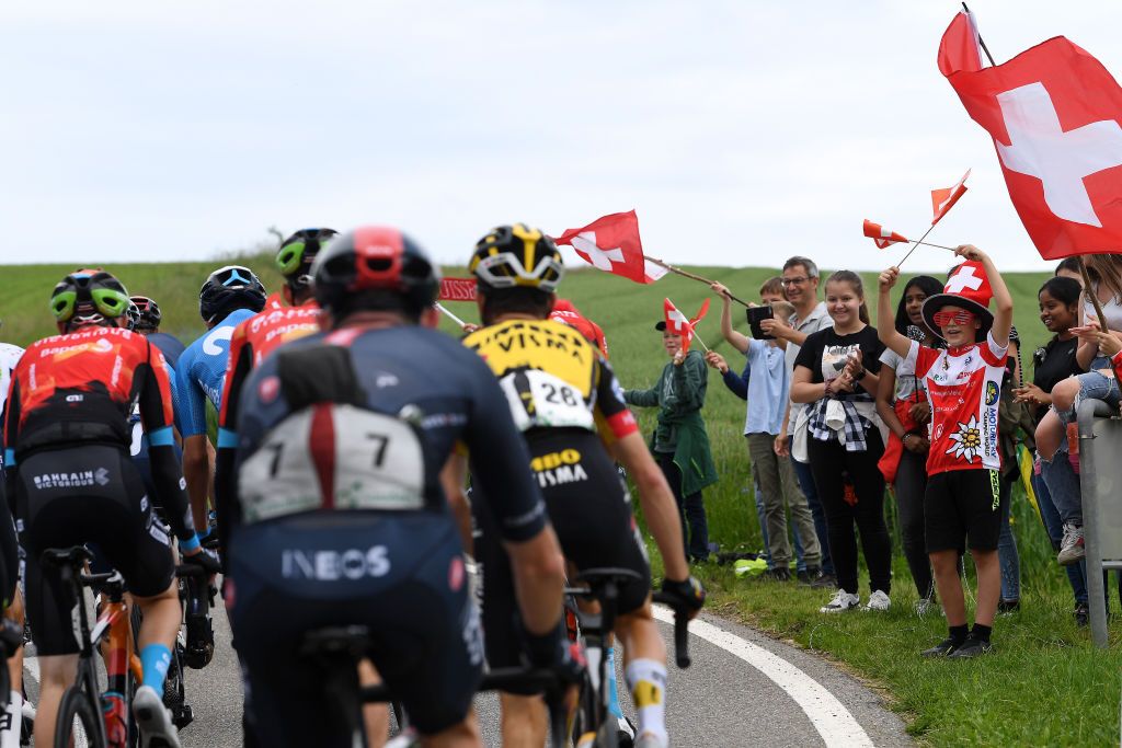LACHEN SWITZERLAND JUNE 07 Swiss fans The peloton during the 84th Tour de Suisse 2021 Stage 2 a 178km stage from Neuhausen am Rheinfall to Lachen Public Flag UCIworldtour tds tourdesuisse on June 07 2021 in Lachen Switzerland Photo by Tim de WaeleGetty Images