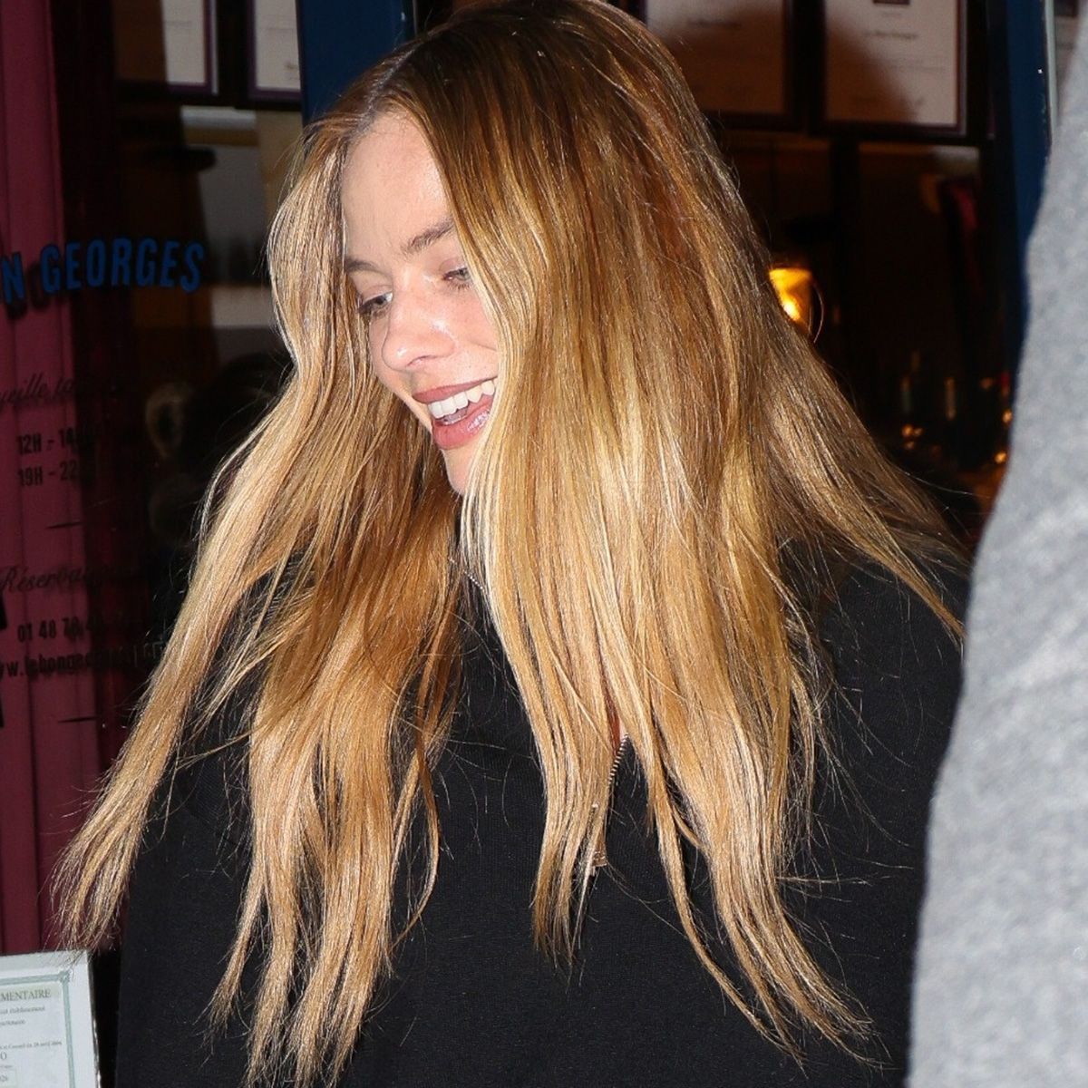 Margot Robbie was seen enjoying a day out with friends while spending time in Paris. She wore Chanel jeans and carried a Hermes bag as the group strolled through the city together.