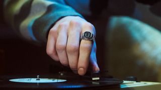 A press photo showing a person wearing the Casio CRW-001-1JR smart ring on their index finger.