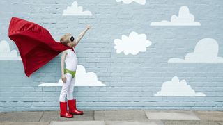 small boy dressed as a superhero