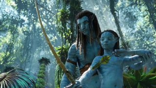 A still from Avatar: The Way of Water showing two Na'vi hunting