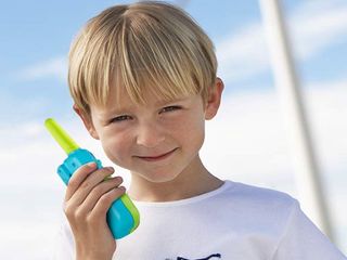 child talking on walkie talkie