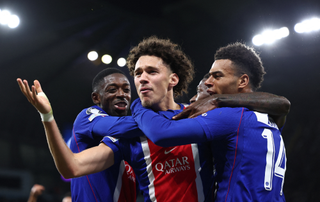Maghnes Akliouche (C) celebrates with teammates after scoring their fourth goal during the UEFA Champions League, league phase football match between Manchester City and Paris Saint Germain