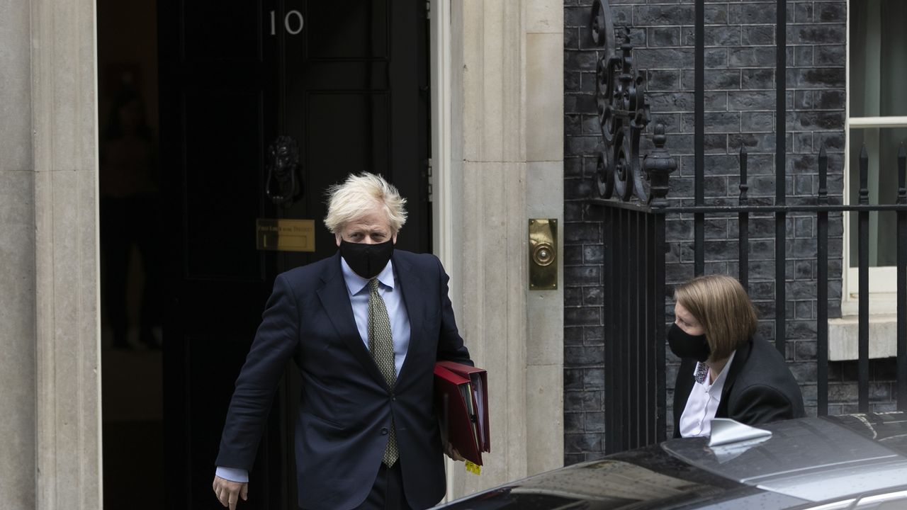 Boris Johnson leaves Downing Street wearing a face mask to attend Prime Ministers&amp;#039; Questions