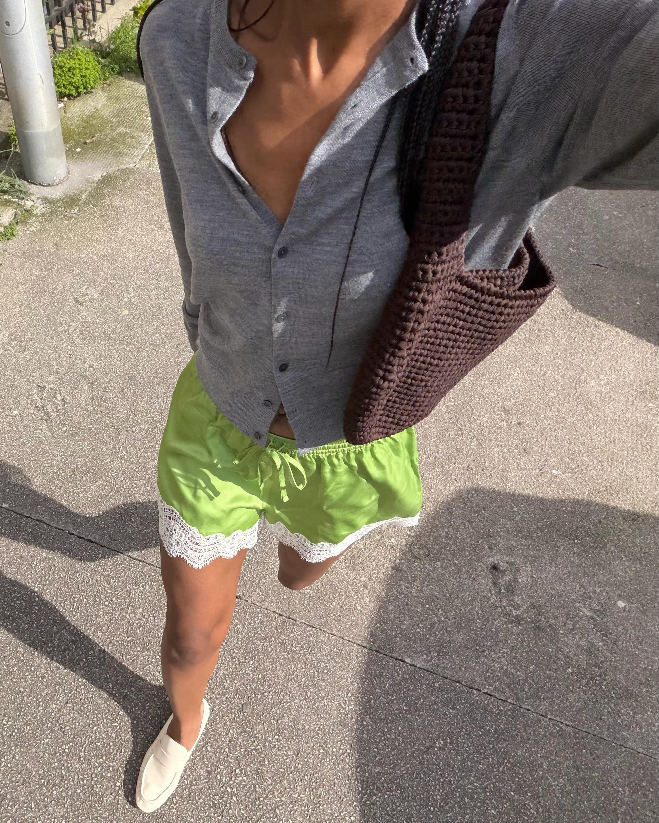 An image of a woman wearing green apple color trend summer 2026
