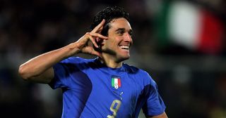 Luca Toni of Italy celebrates scoring the second goal during the international friendly match between Italy and Germany at the Artemio Franchi Stadium on March 1, 2006 in Florence, Italy.