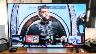 A graphic for Black Panther appears in the TV app on a TV connected to the Apple TV 4K (2022)