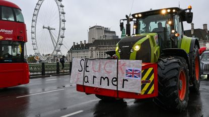 A farmer drives a tractor over Westminster Bridge during a protest by farmers over inheritance tax changes