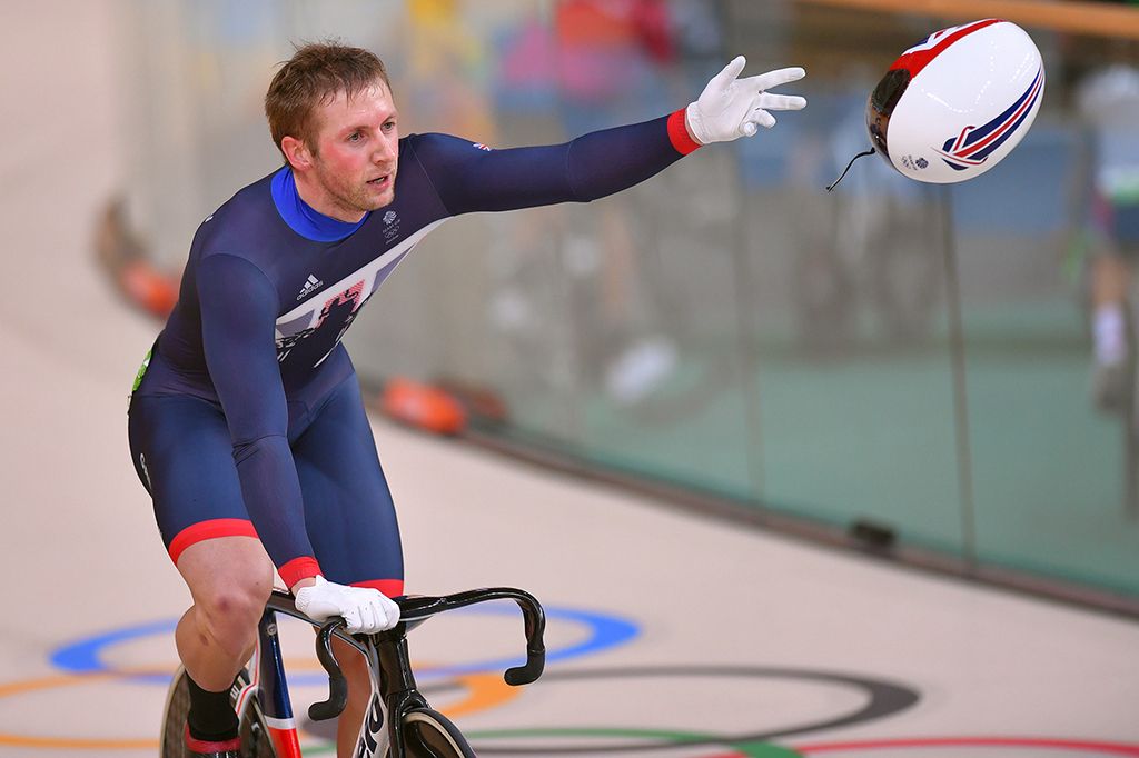 Jason Kenny throws off his helmet after winning the gold medal in the Keirin