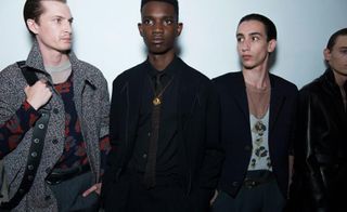 4 male models standing in a line