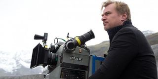 Christopher Nolan in front of his IMAX camera, in the mountains