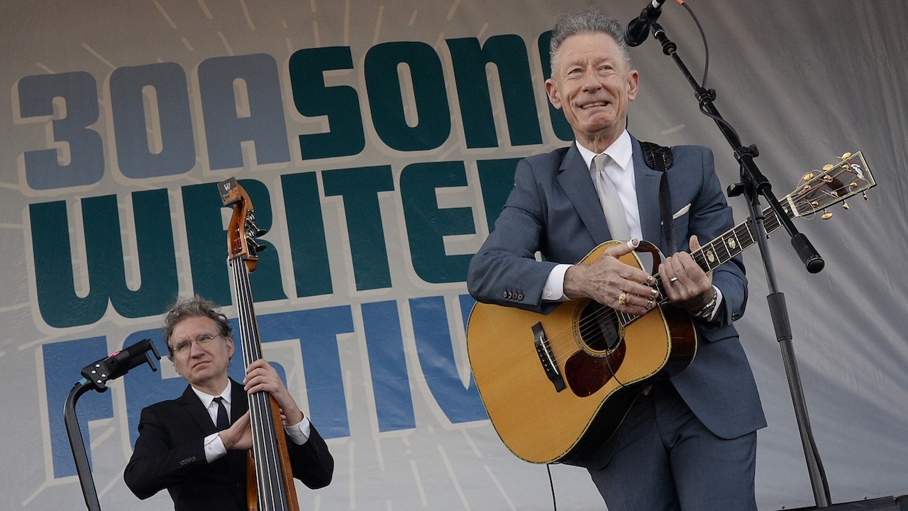 Lyle Lovett (right) and Viktor Krauss perform at the 2023 30A Songwriters Festival on January 14, 2023, in South Walton, Florida.