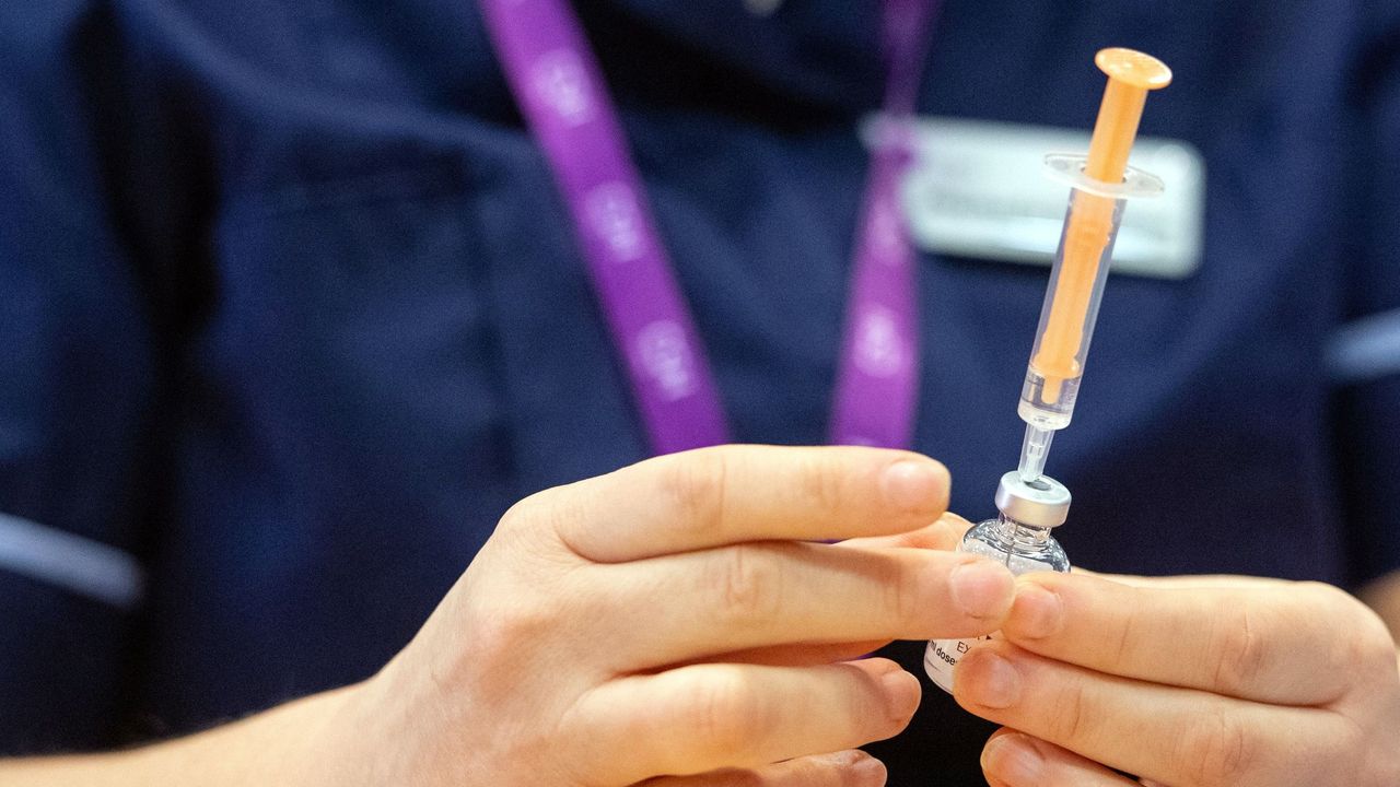 A nurse prepares a dose of the Oxford/AstraZeneca Covid-19 vaccine