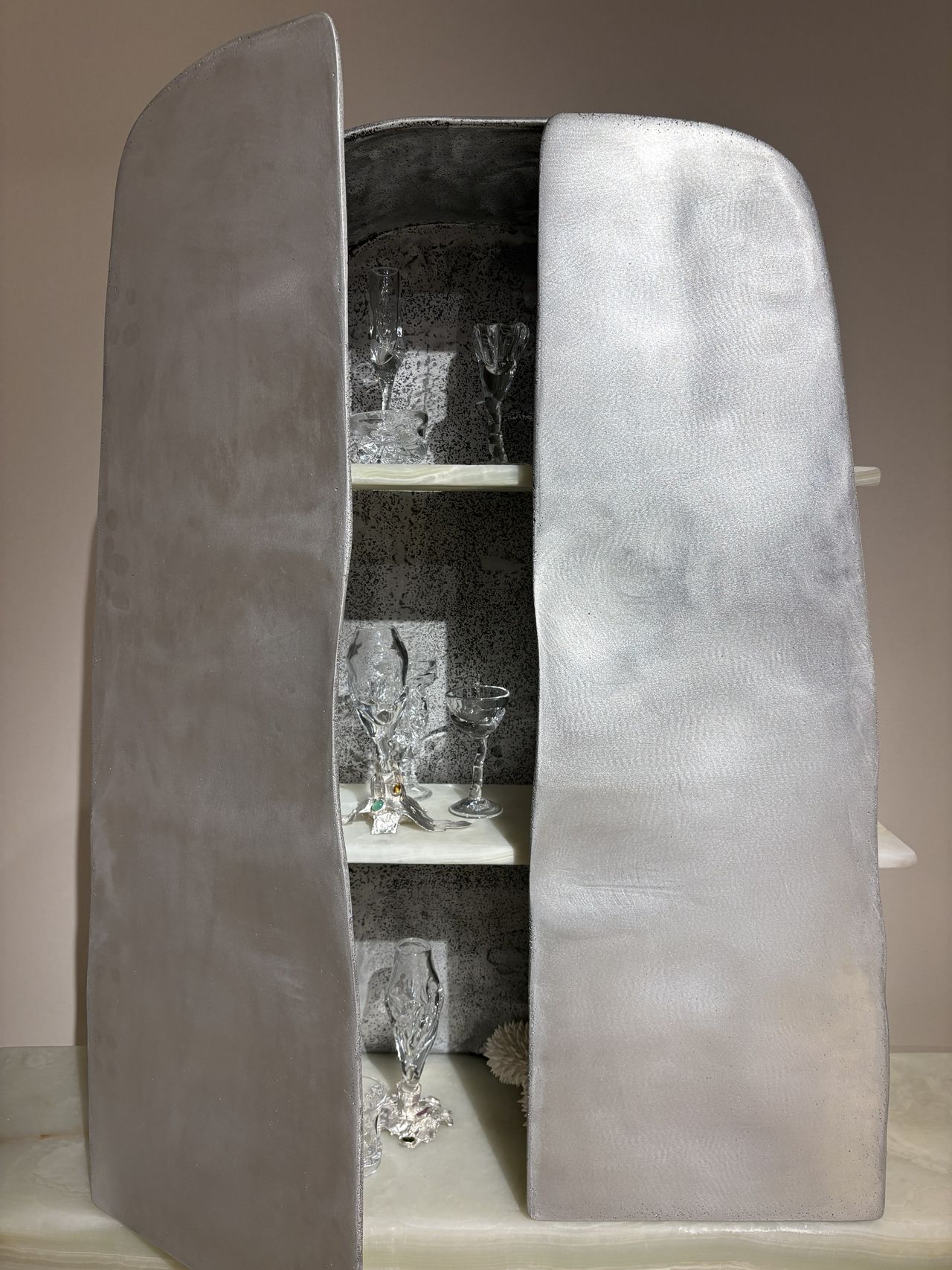 Installation view of a series of experimental furniture pieces showcased in galleries and hotel bedrooms in an elevated setup.