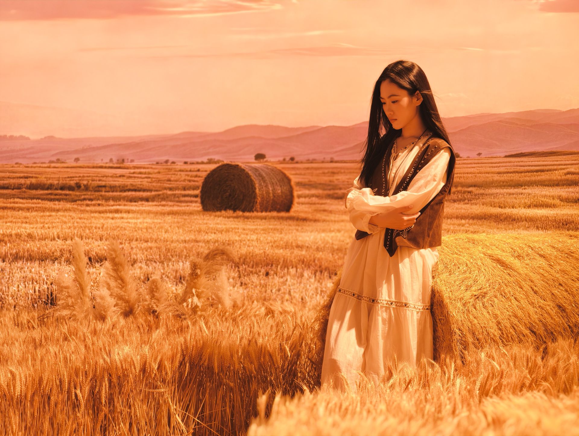 Woman in a field of hay