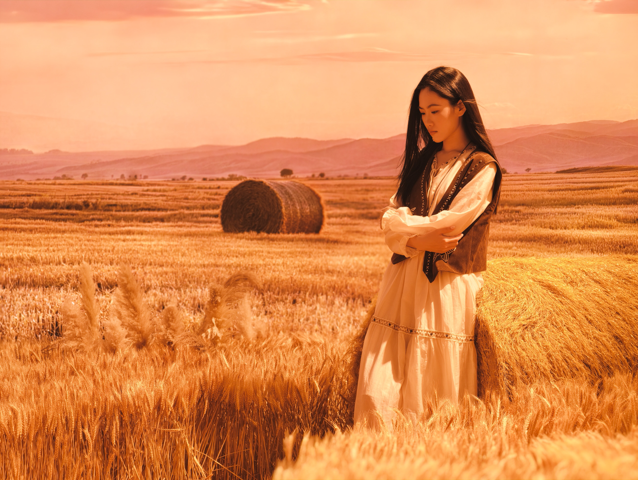 Woman in a field of hay