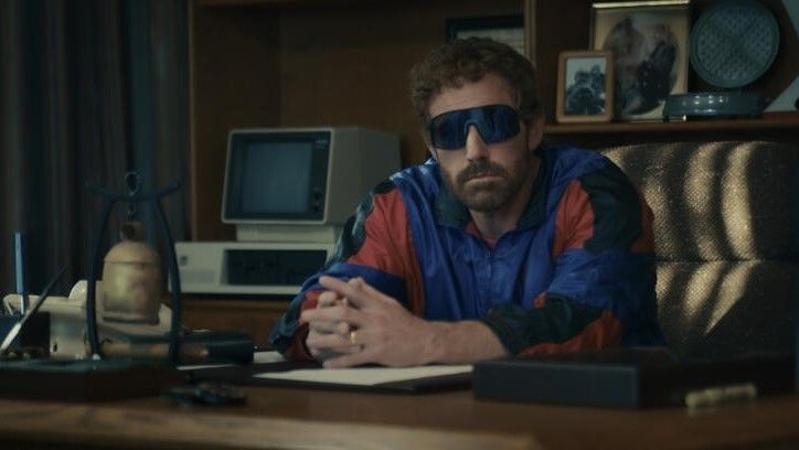 Ben Affleck wearing sunglasses at a desk in AIR