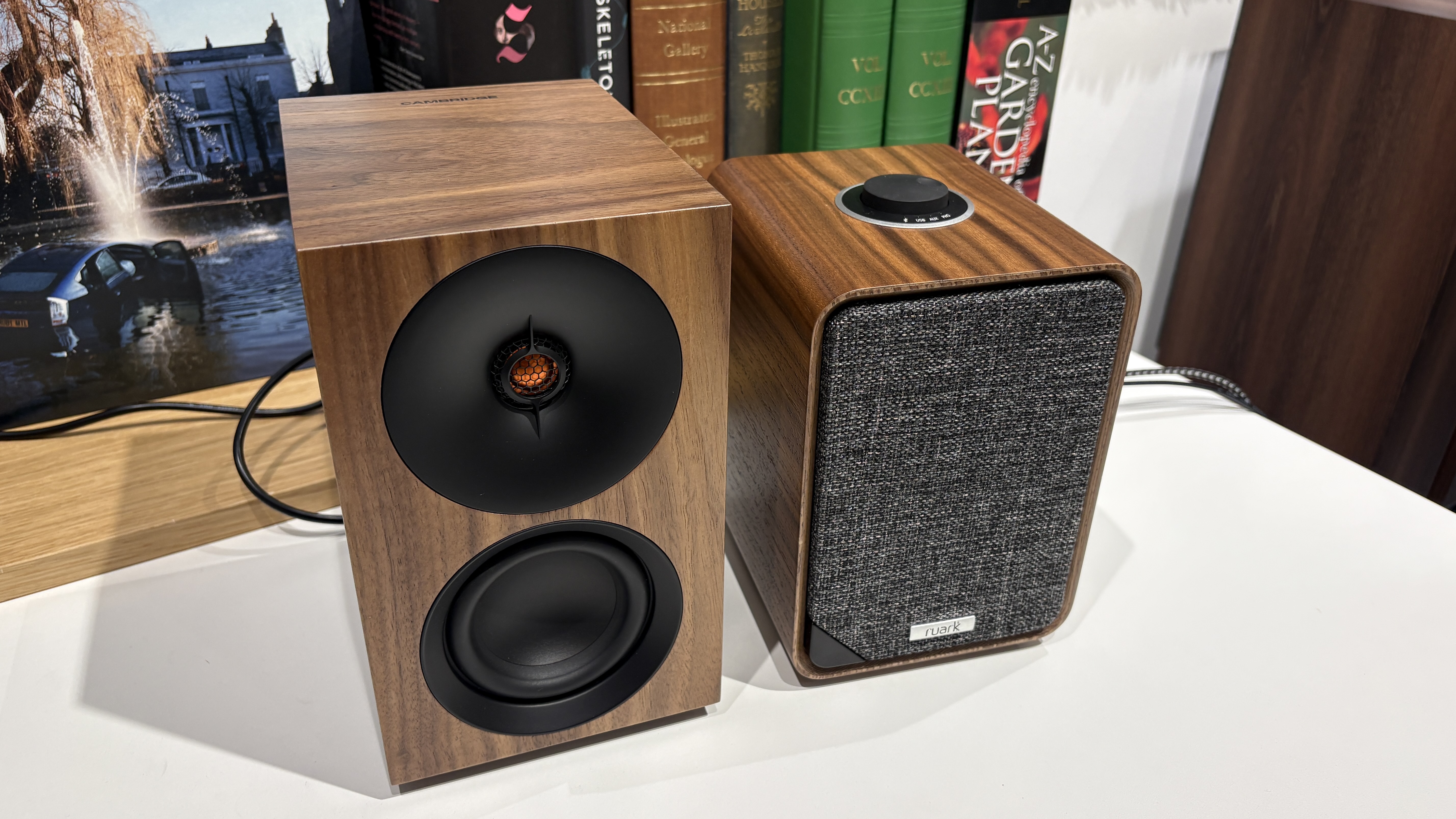 Ruark MR1 Mk3 and Cambridge L/R S speakers side-by-side on white table